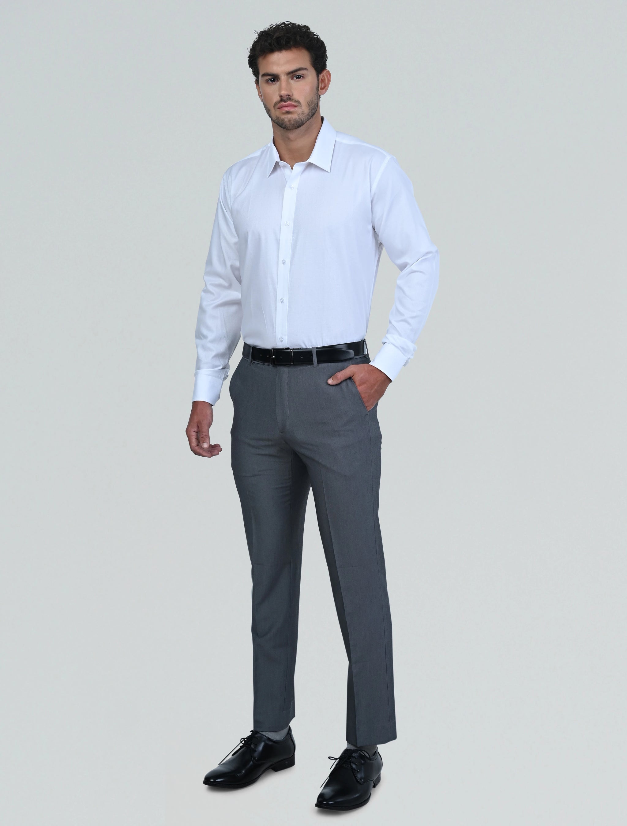 Full-length model wearing the Marshall Menswear Monaco White men's Egyptian cotton dress shirt with black dress trousers and leather shoes for a sophisticated office-ready outfit.
