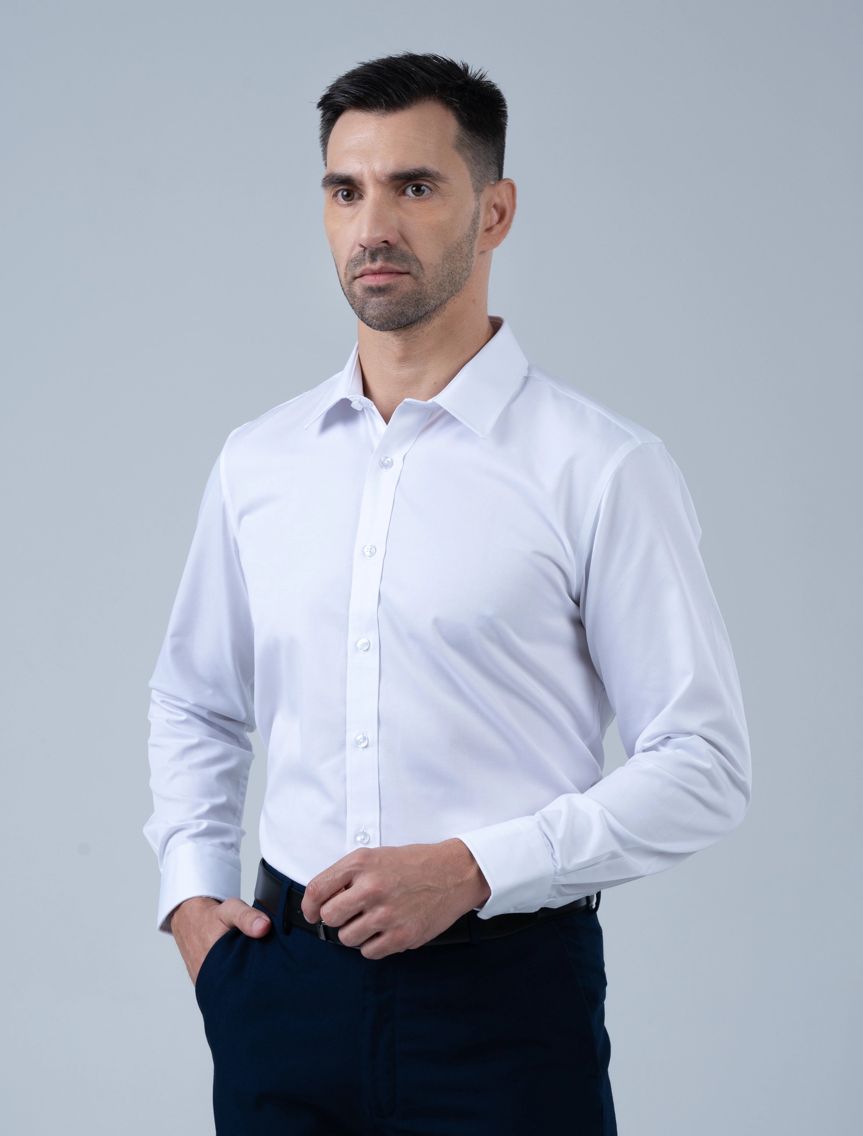 Marshall Menswear Cambridge white men's dress shirt with a tailored fit, crisp collar and  cotton fabric, styled with navy trousers for a sharp professional office look.