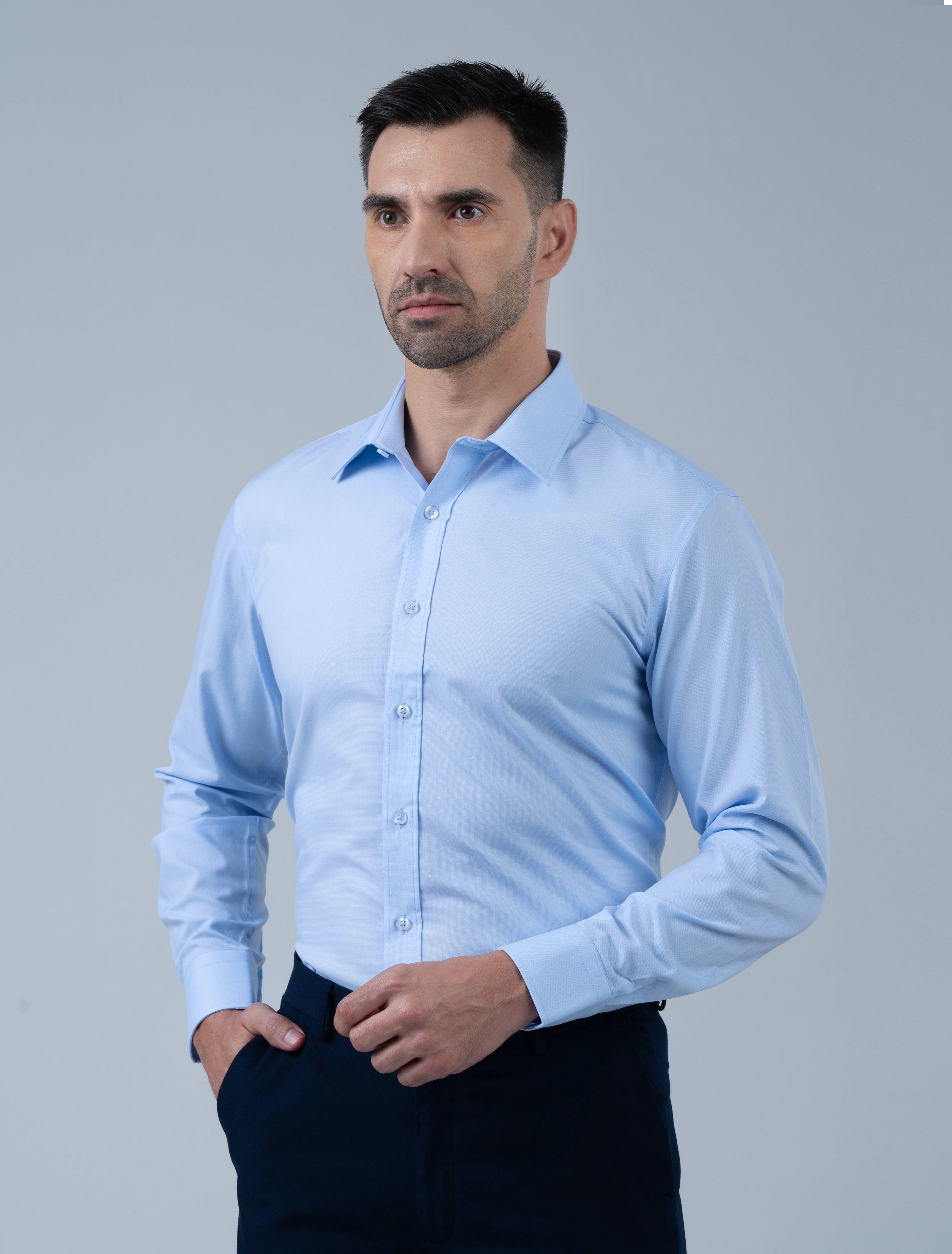Model wearing the Marshall Menswear Kingsley premium men's formal shirt in light blue, showcasing a tailored silhouette, crisp collar and refined officewear.
