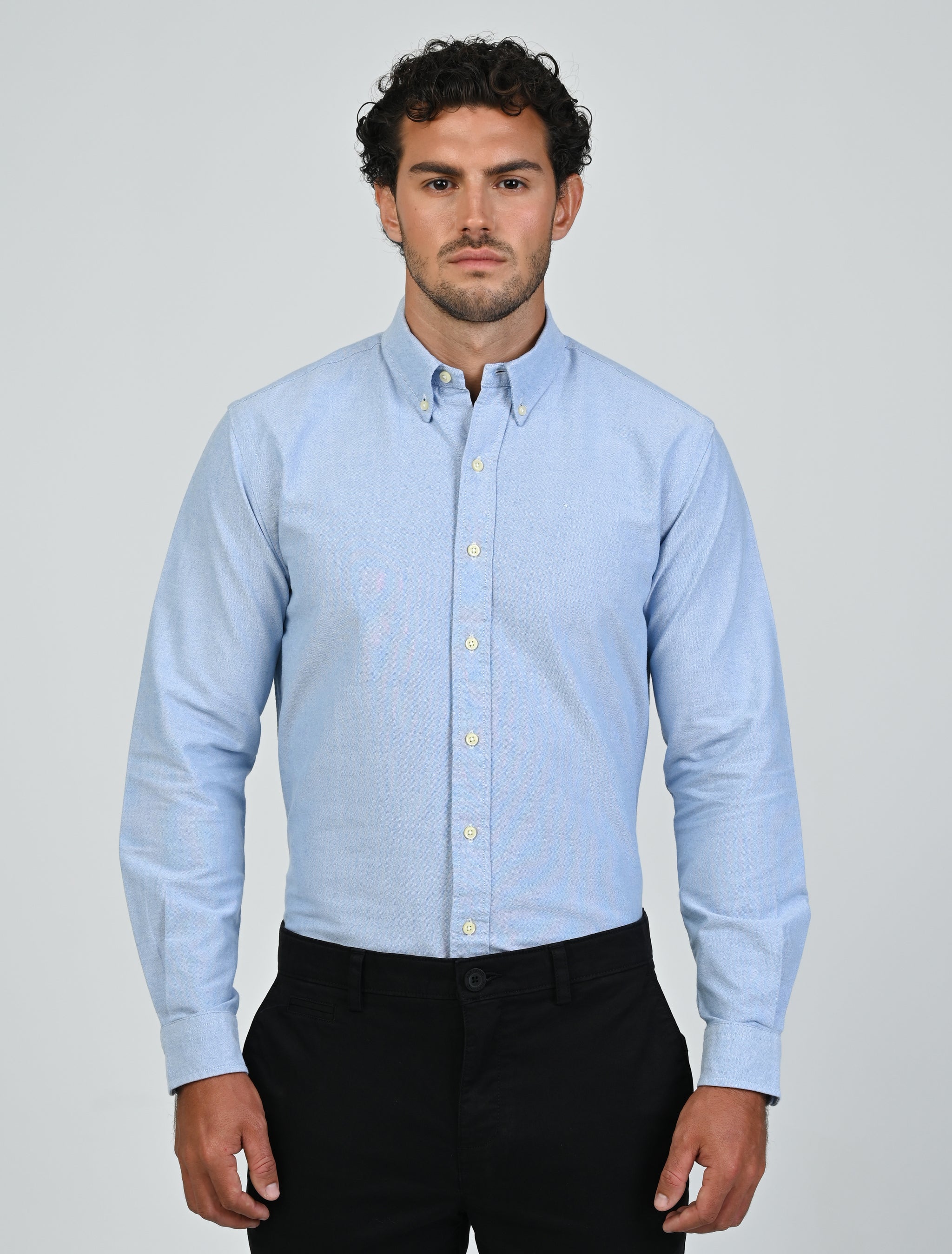 Front view of the Marshall Menswear Harrington Oxford Shirt in tropical blue featuring Oxford cotton, long sleeves and a button-down collar.