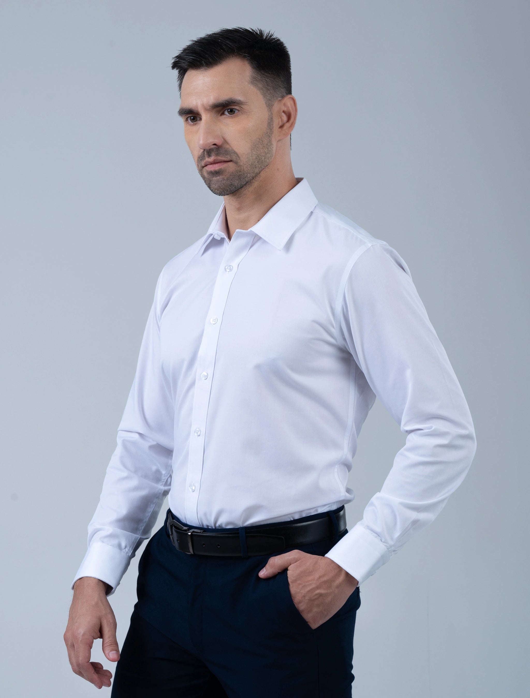Model wearing the Marshall Menswear Cambridge premium white men's dress shirt featuring a tailored silhouette, crisp collar and refined business attire.