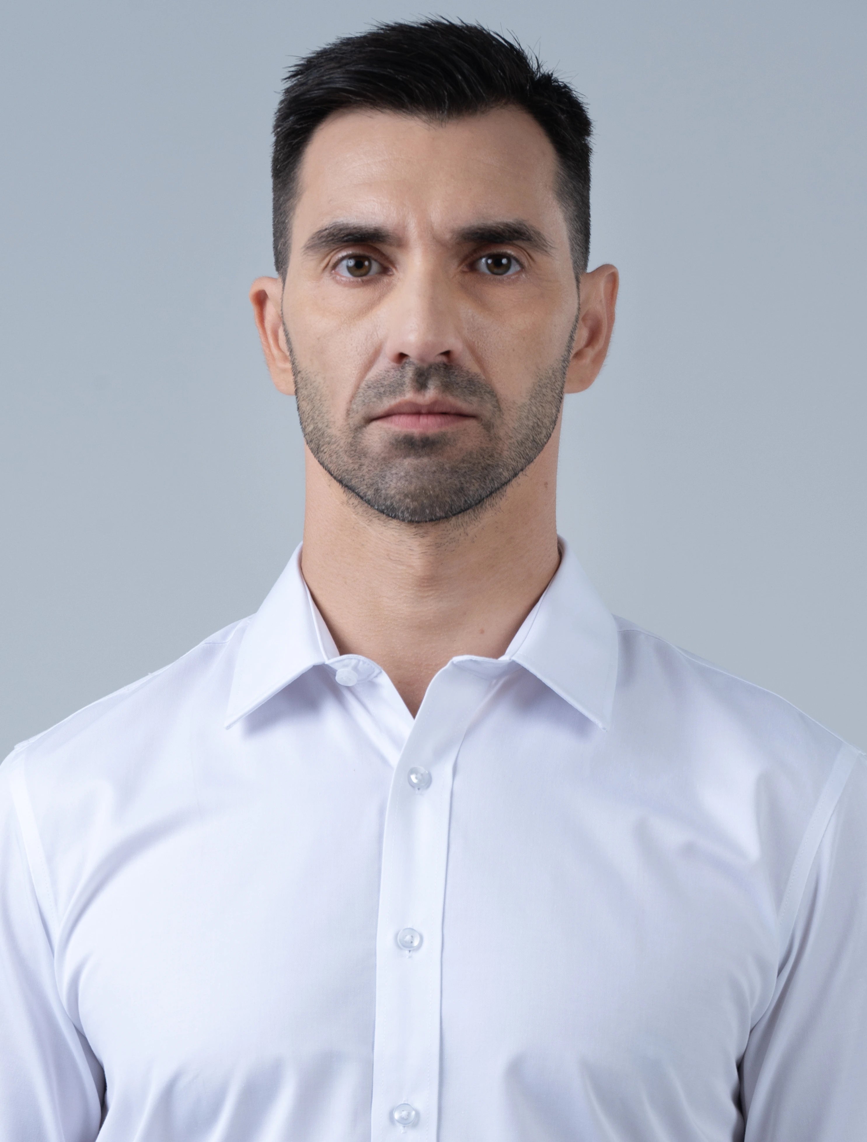 Close-up of the Marshall Menswear Cambridge premium white men's dress shirt highlighting the crisp collar, clean front placket and tailored finish for formal office wear.