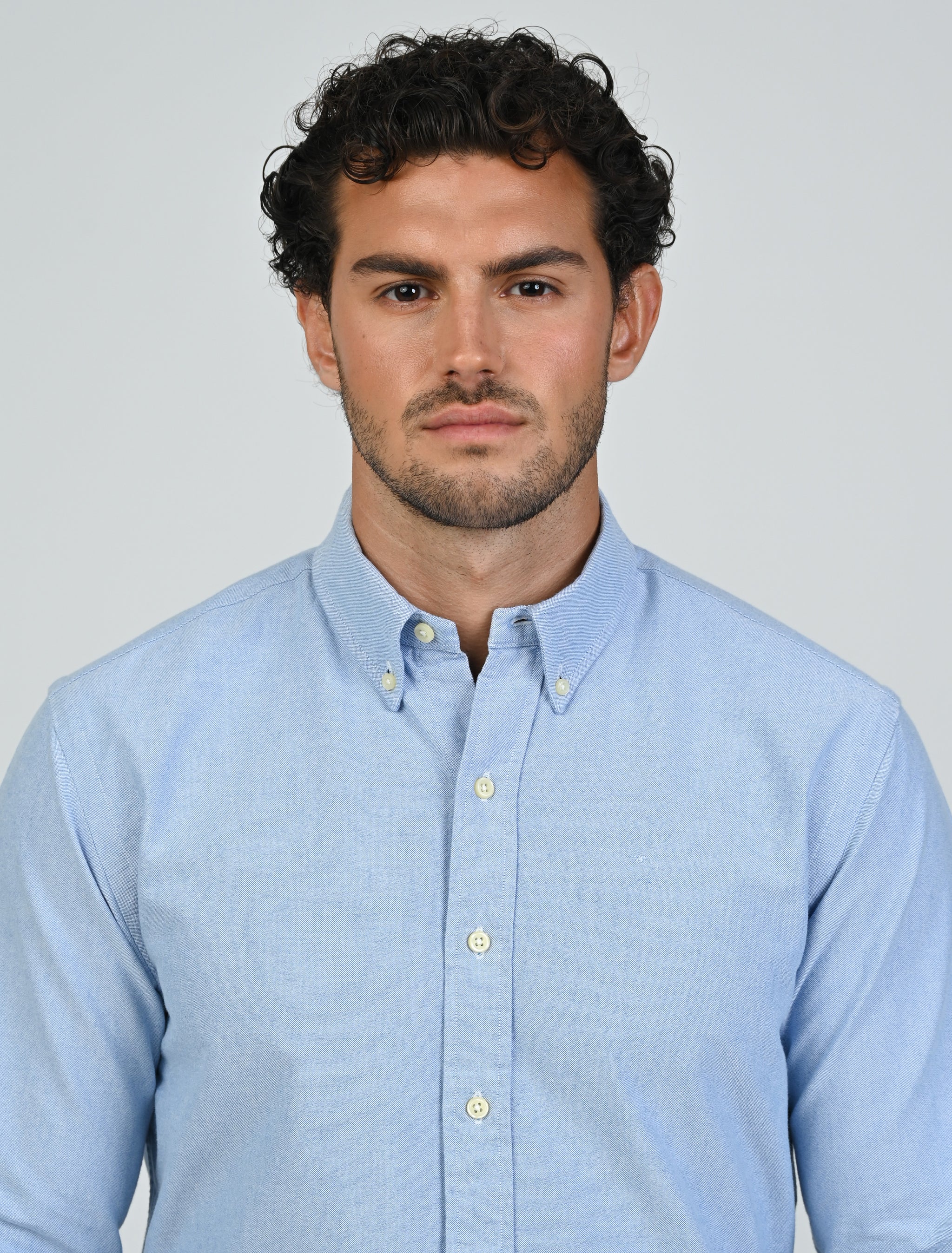 Close-up of the Marshall Menswear Harrington Oxford Shirt in tropical blue showing the Oxford cotton weave and button-down collar.