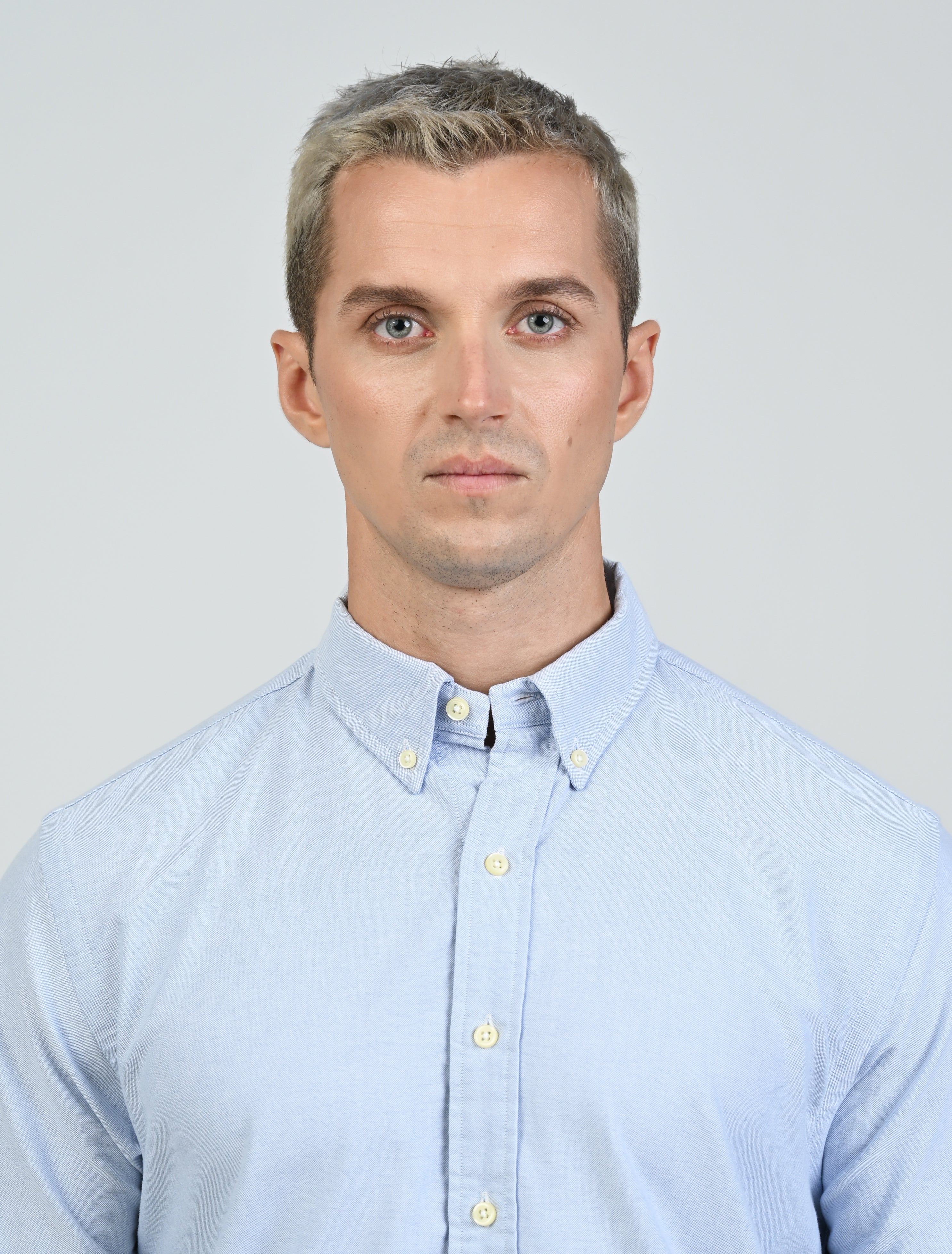 Close-up of the Marshall Menswear Harrington Oxford Shirt in light blue showing the Oxford cotton weave and button-down collar.