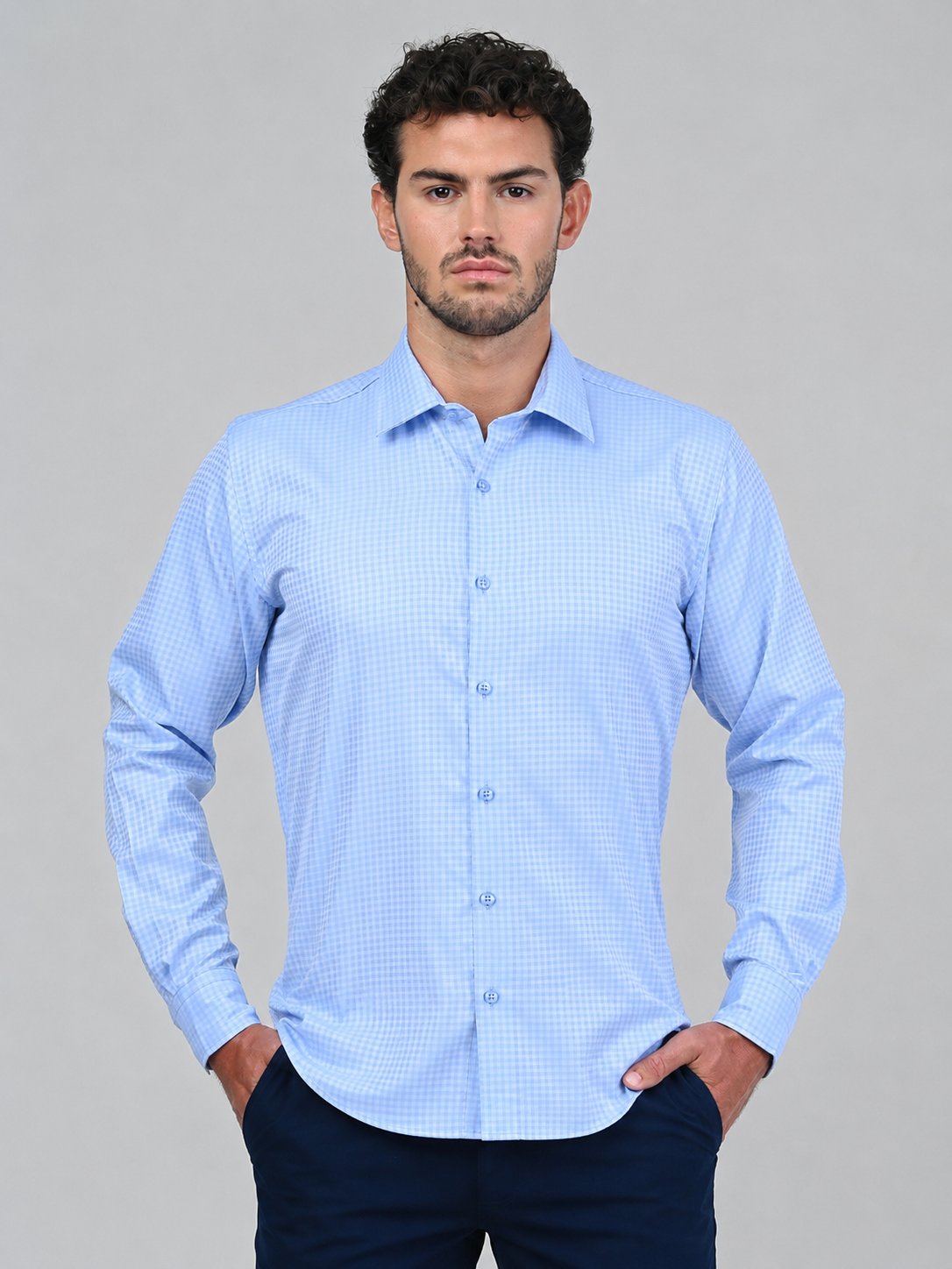 Front view of the Marshall Menswear Belgrave Light Blue men's smart casual shirt featuring a subtle micro-check pattern, spread collar, long sleeves and a tailored fit.