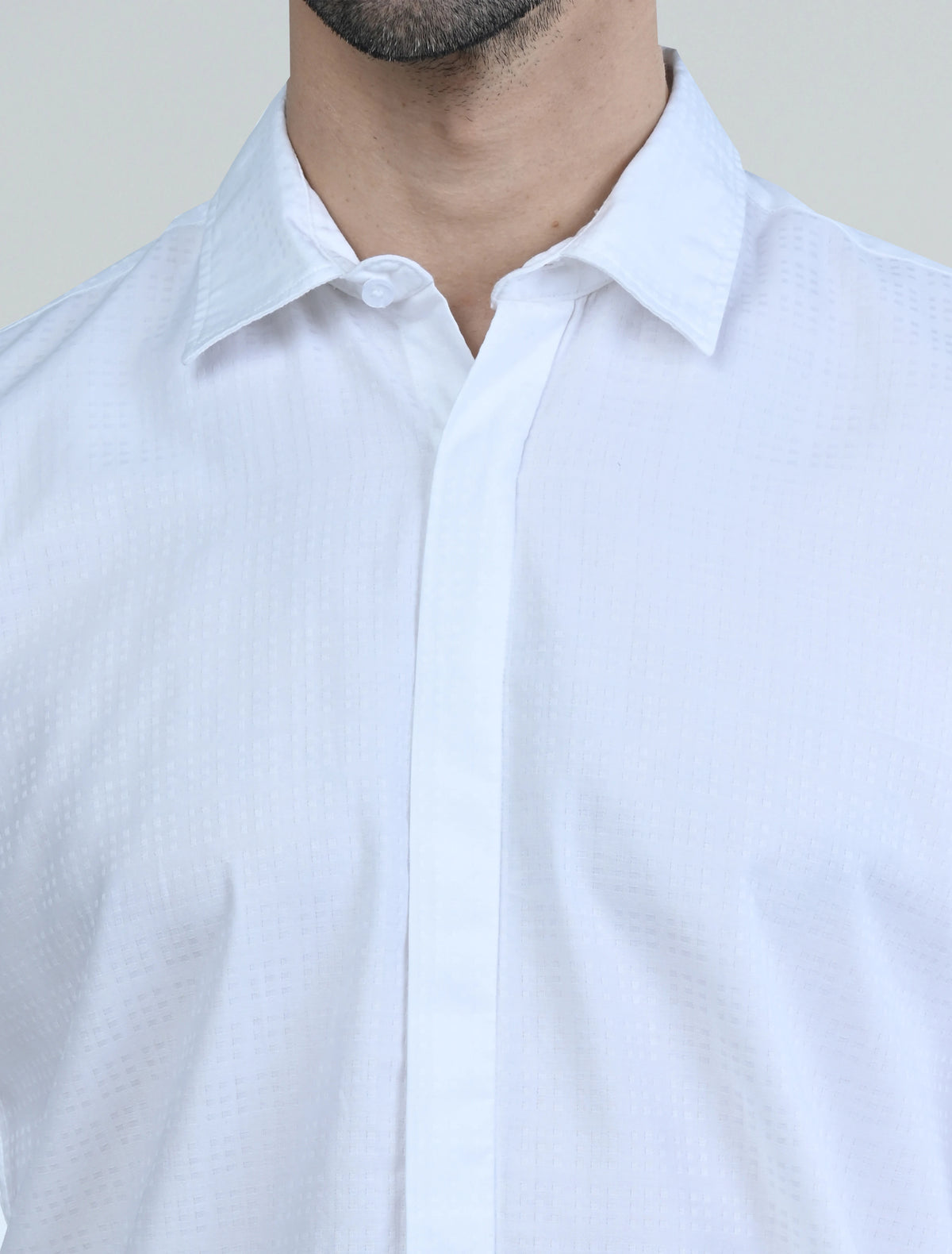 Close-up of the Marshall Menswear Langford Olive Green men's linen shirt highlighting the  texture, spread collar, button placket and lightweight woven fabric.