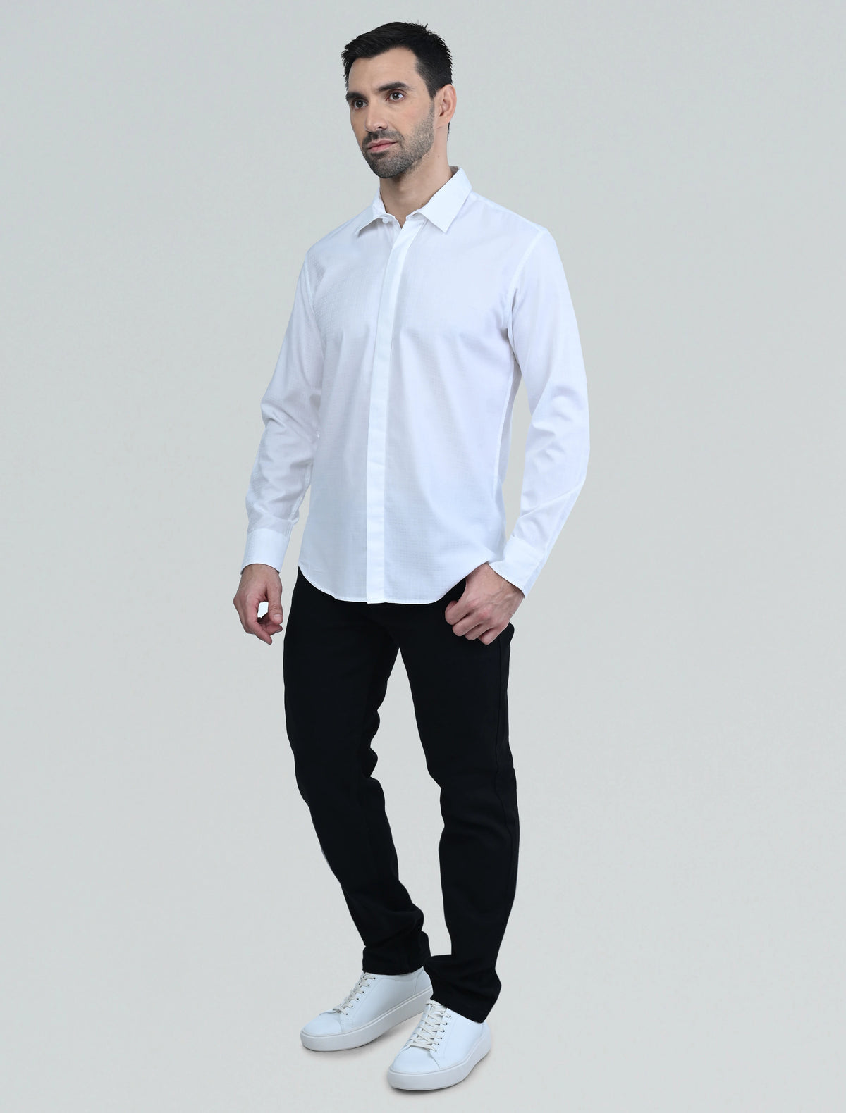 Full-length model wearing the Marshall Menswear Lucien White men's casual shirt  for a clean summer smart casual outfit. 