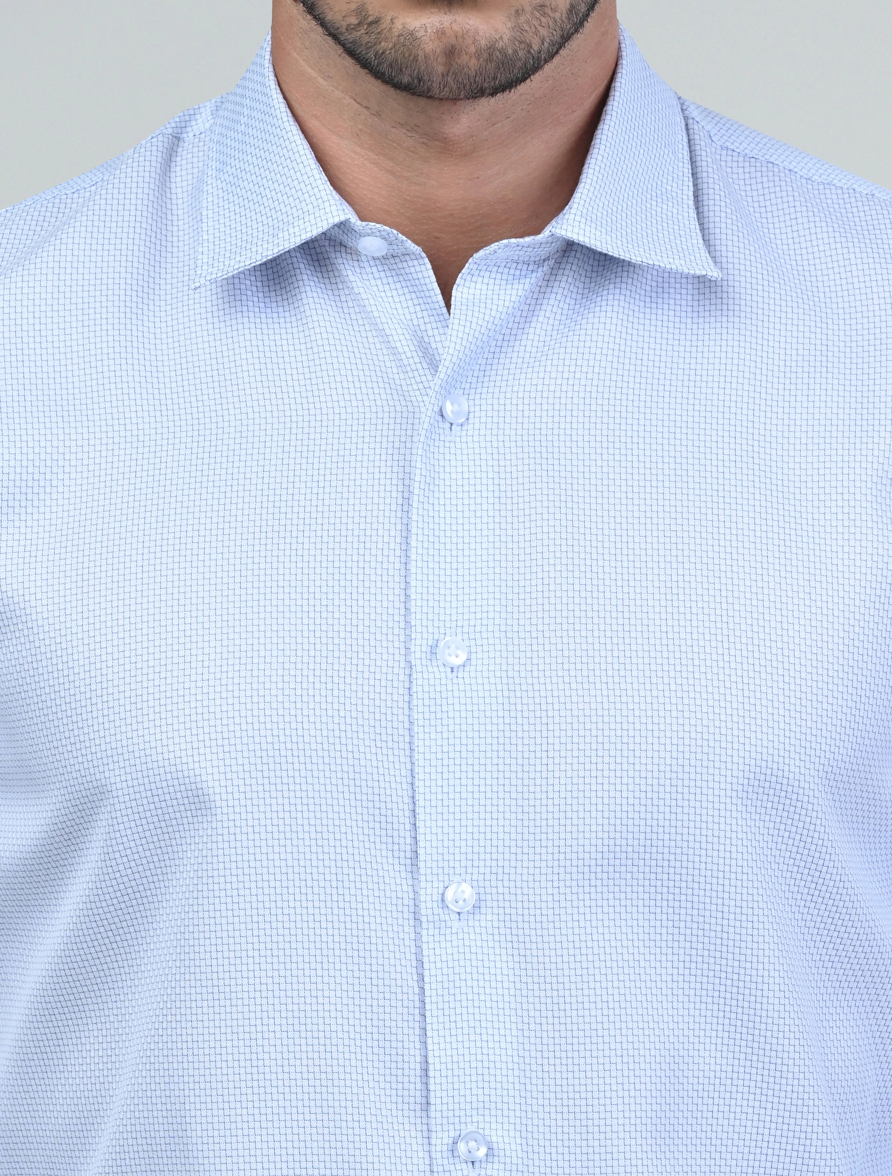 Close-up of the Marshall Menswear Montague White men's dress shirt highlighting the refined textured fabric, premium buttons and structured spread collar for a polished finish.