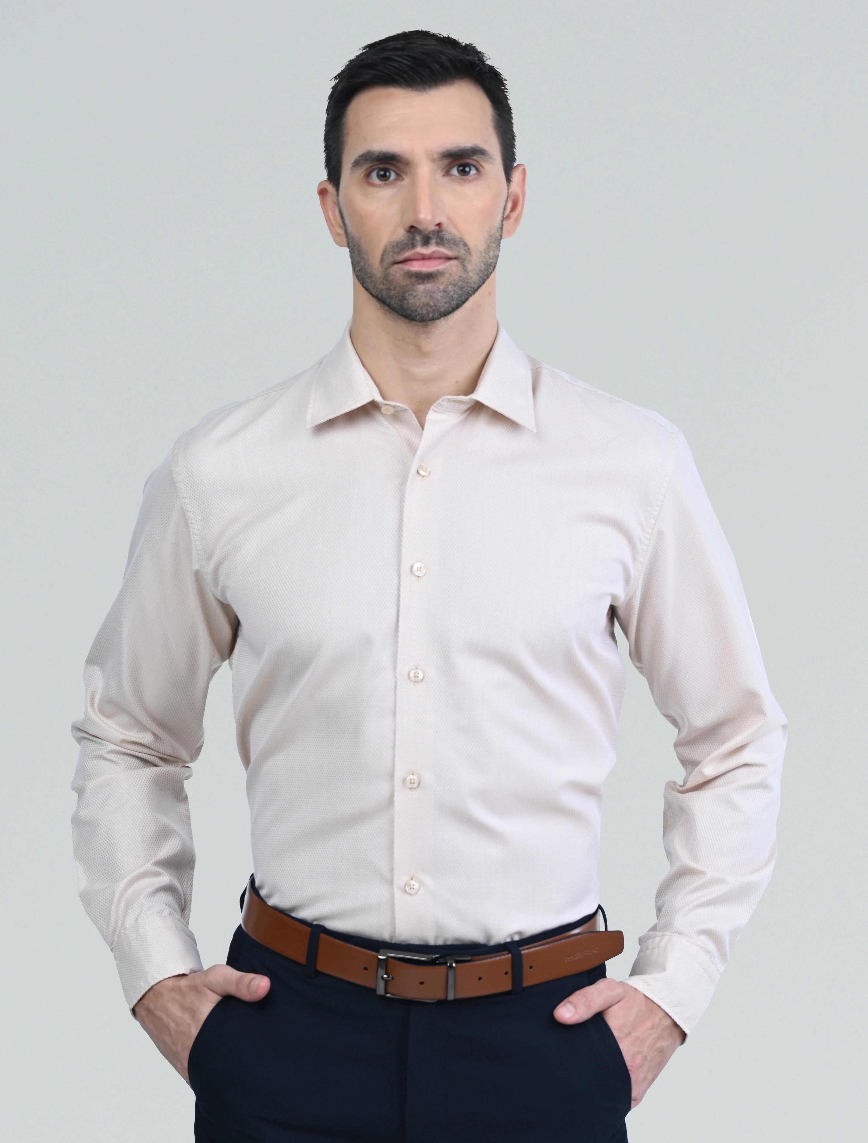 Marshall Menswear men's beige casual shirt with a tailored fit, classic collar, and long sleeves, styled with navy chinos for a smart casual everyday look.
