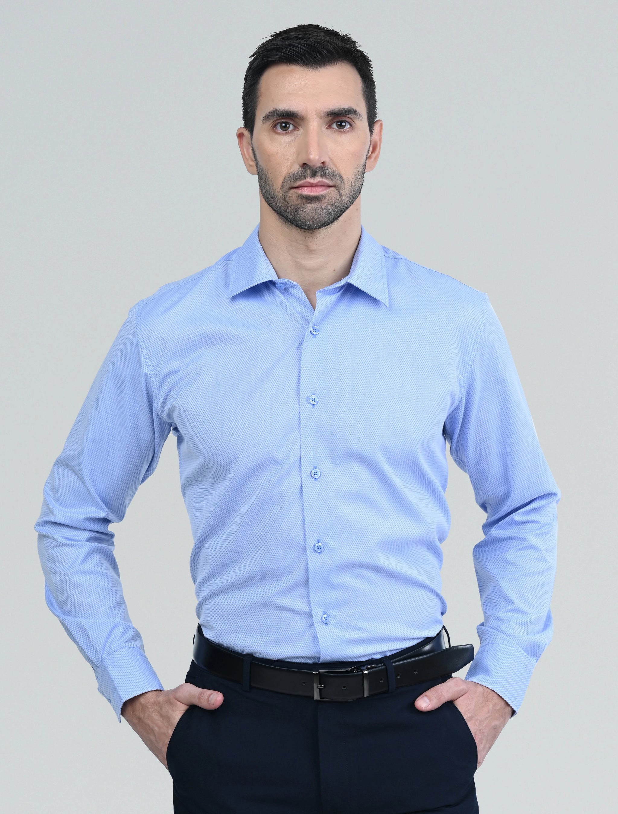 Marshall Menswear men's blue casual shirt with a tailored fit, classic collar, and long sleeves, styled  with navy chinos for a refined smart casual look.