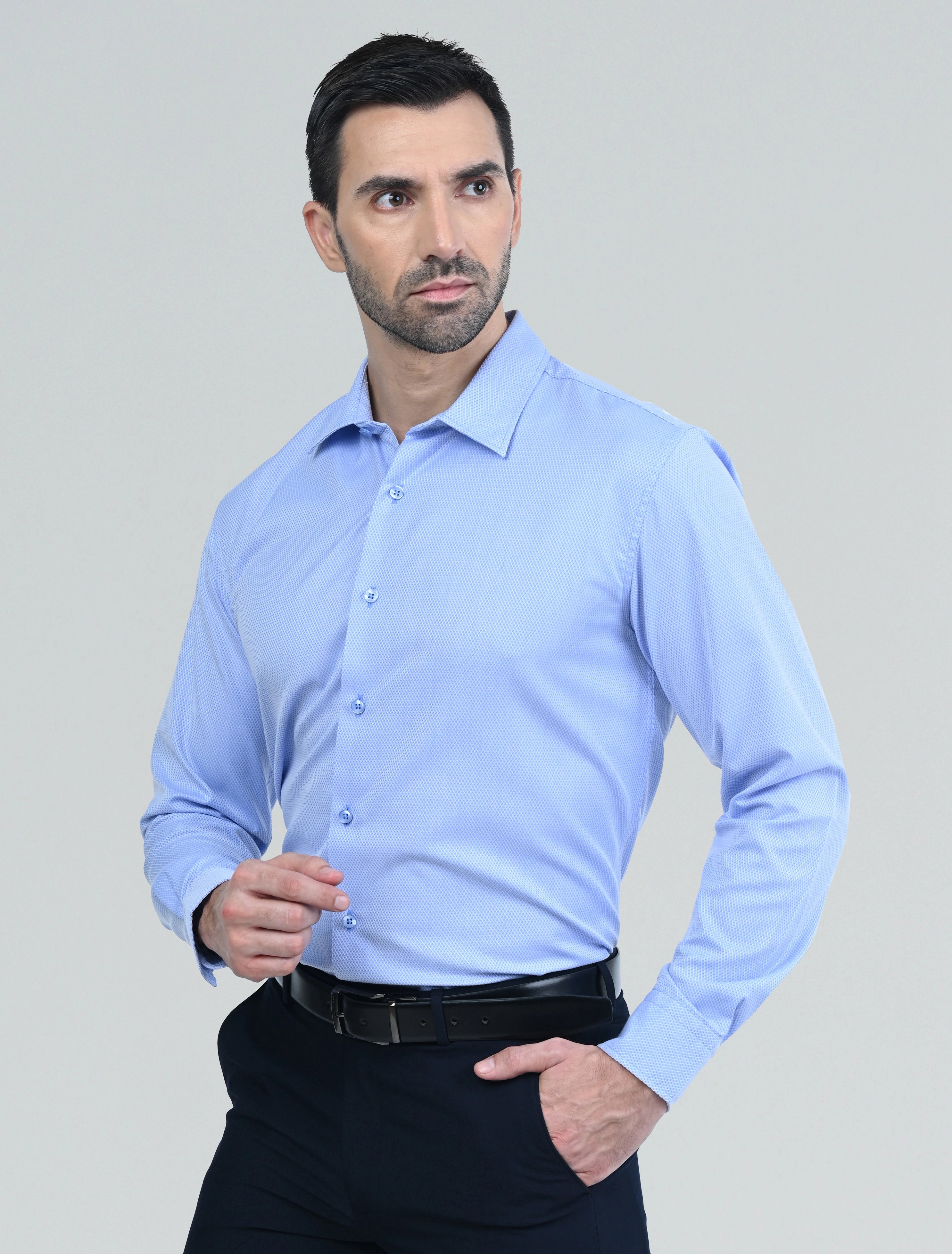 Marshall Menswear men's blue casual shirt with a tailored fit, classic collar, and button-front placket, styled for a modern smart casual look.