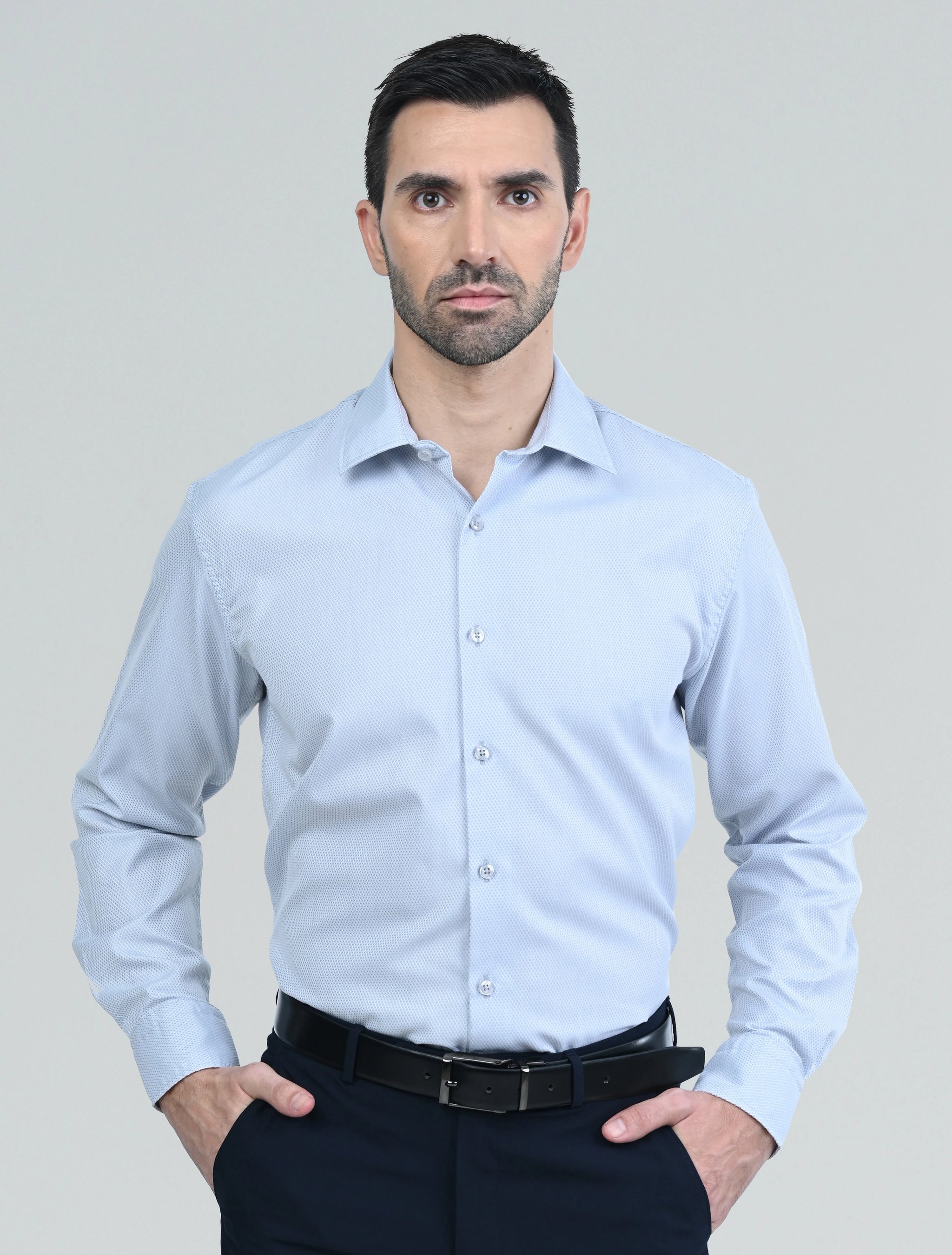 Marshall Menswear men's grey casual shirt with a tailored fit, classic collar, and long sleeves, styled with navy chinos for a refined smart casual look.