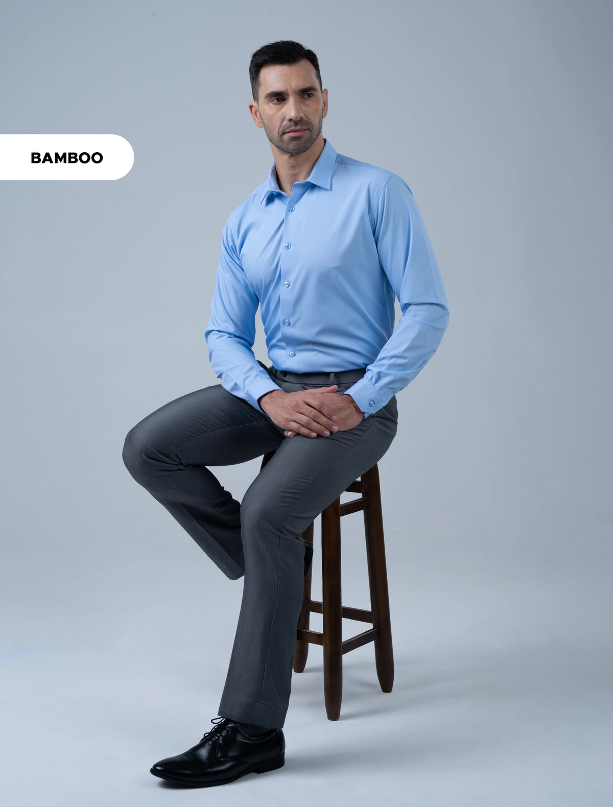 Marshall Menswear Bromley blue men's  bamboo shirt styled with grey trousers, a versatile business casual shirt for office, work and smart professional we