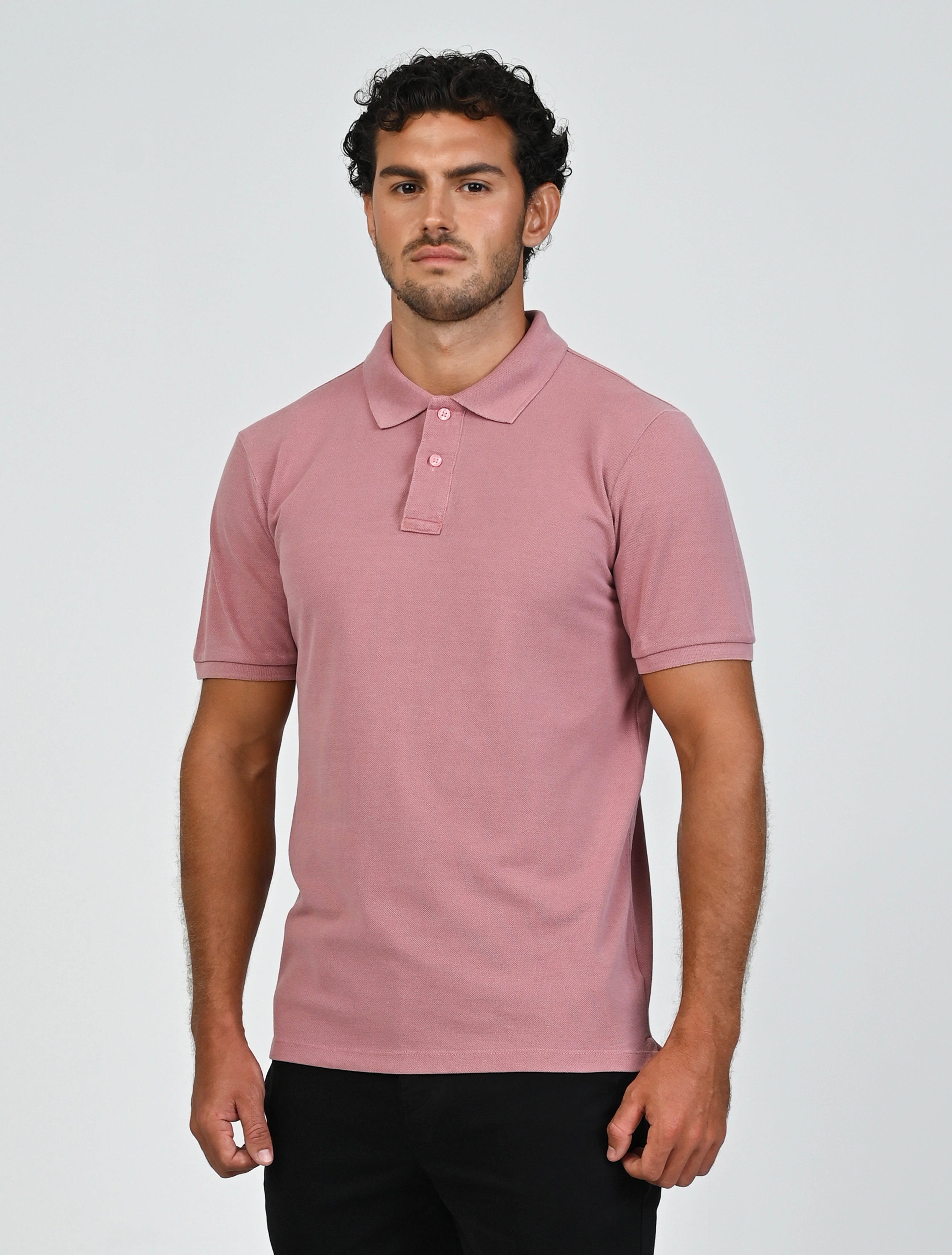 Three-quarter view of Marshall Menswear Atelier Salmon Pink men's polo shirt with tailored fit, cotton pique fabric and short sleeves for smart casual wear.
