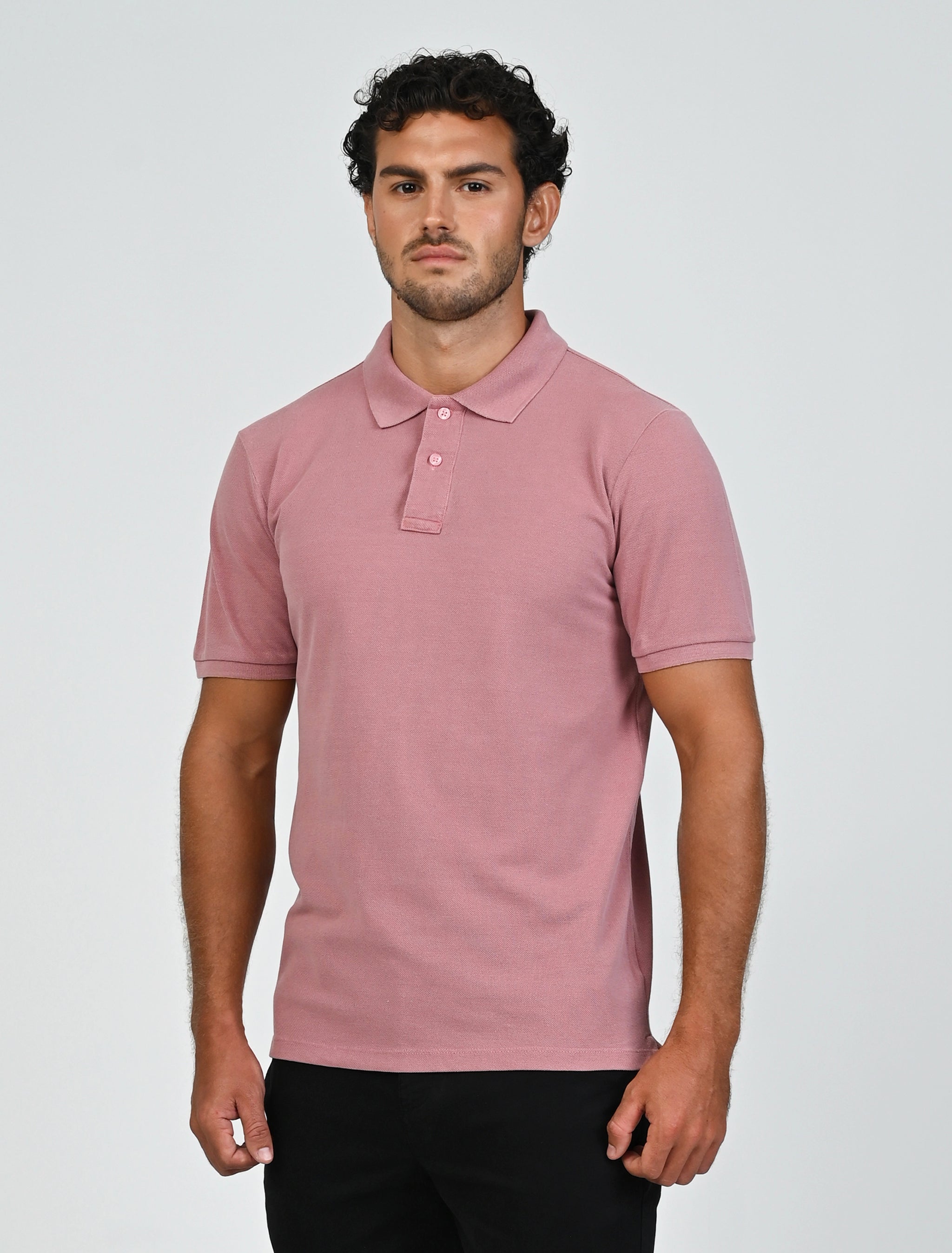 Three-quarter view of Marshall Menswear Atelier Salmon Pink men's polo shirt with tailored fit, cotton pique fabric and short sleeves for smart casual wear.