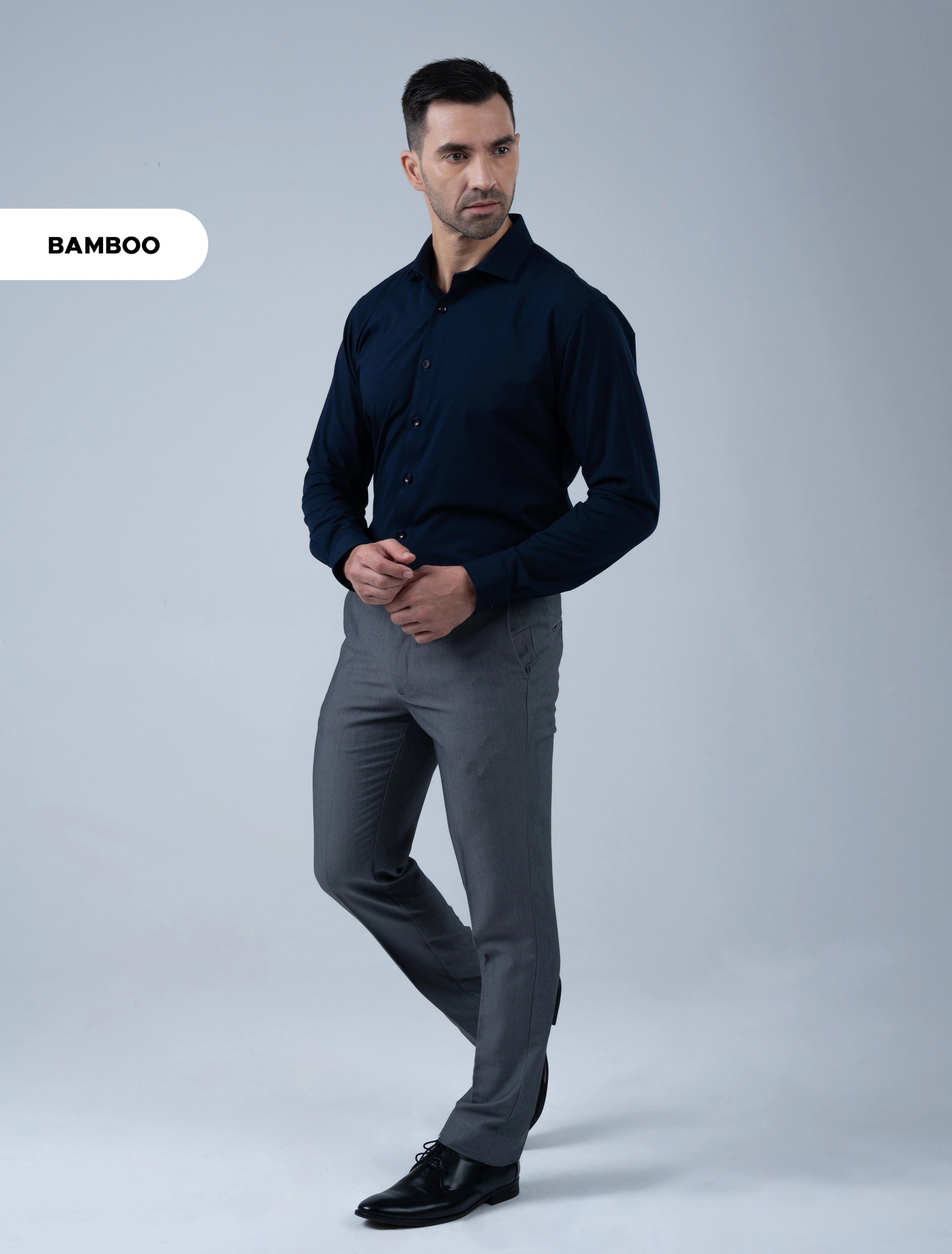 Marshall Menswear Westbury dark navy bamboo shirt for men styled with grey trousers and dress shoes for evening wear, dinners and special occasions.
