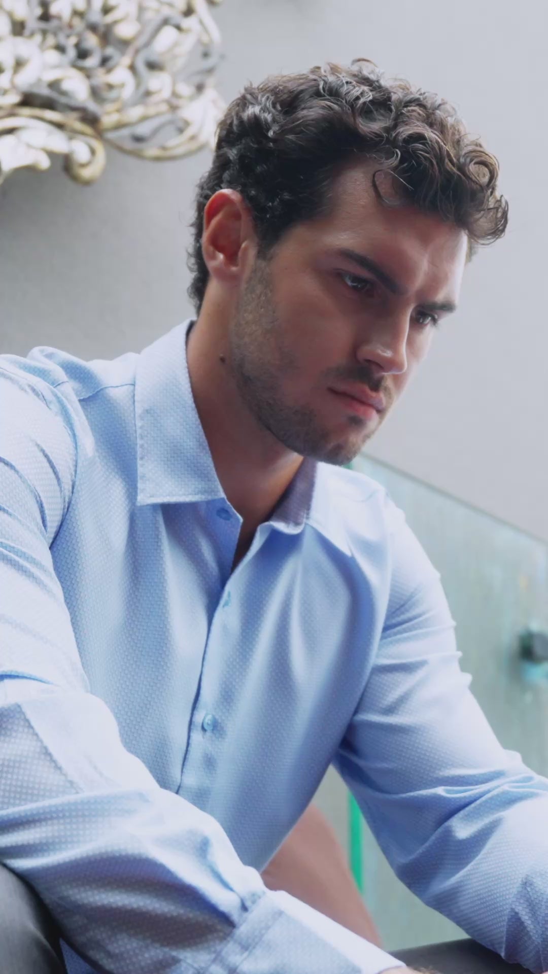Model wearing the Marshall Menswear Montague Light Blue men's textured dress shirt styled with navy tailored trousers for a refined smart casual look that transitions effortlessly from office to evening.
